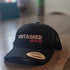 Black Flex fit baseball cap with pink embroidery slogan saying Untamed Dream Big