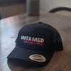 Black Flex fit baseball cap with pink embroidery slogan saying Untamed Confidence for all.
